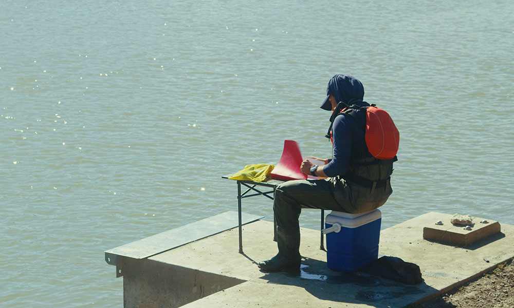nait applied researcher aldo fumagalli at work by the water