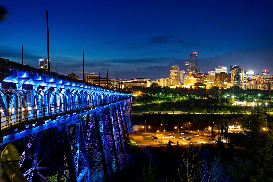 Edmonton's High Level Bridge lit up in NAIT blue