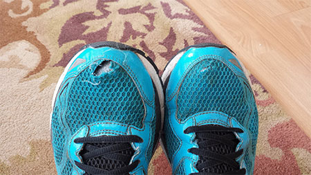 running shoes blown-out toe