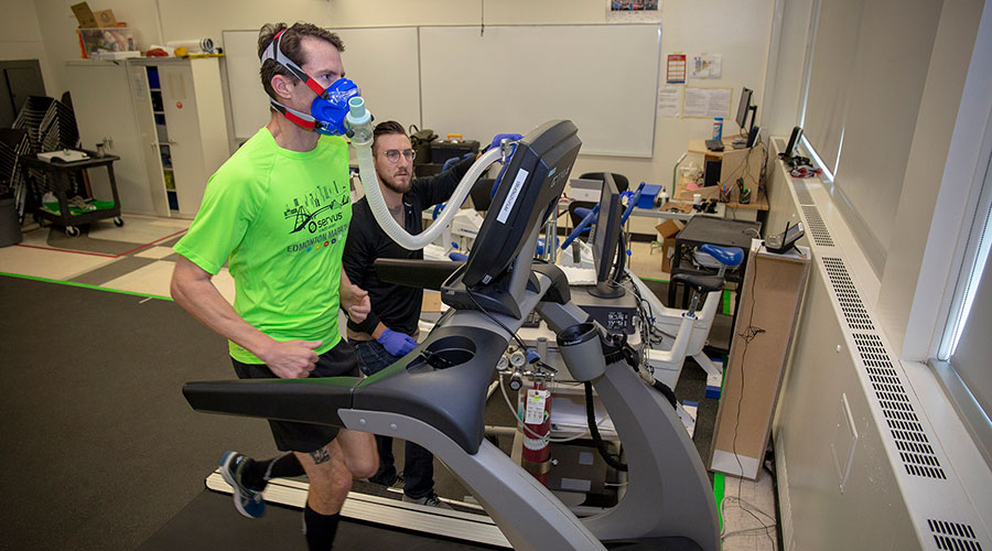 nait personal fitness trainer instructor Dr. Tim Just administers a VO2 max test for runner Scott Messenger