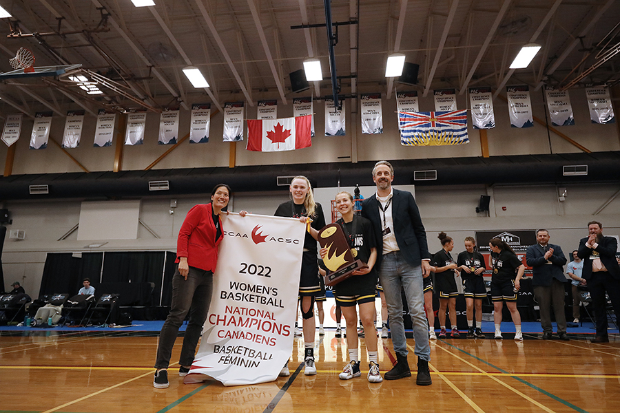 nait ooks women's basketball defeats vancouver island university for gold at the Canadian Collegiate Athletics Association championships; Hallie Watt and Katherine McDougall pose with trophy