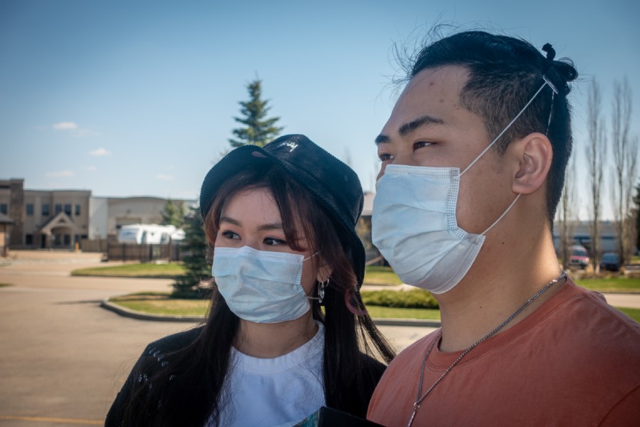 Jonathan Mui and Denise Bermejo, NAIT DMIT grads and makers of ear protectors for COVID-19 frontline workers