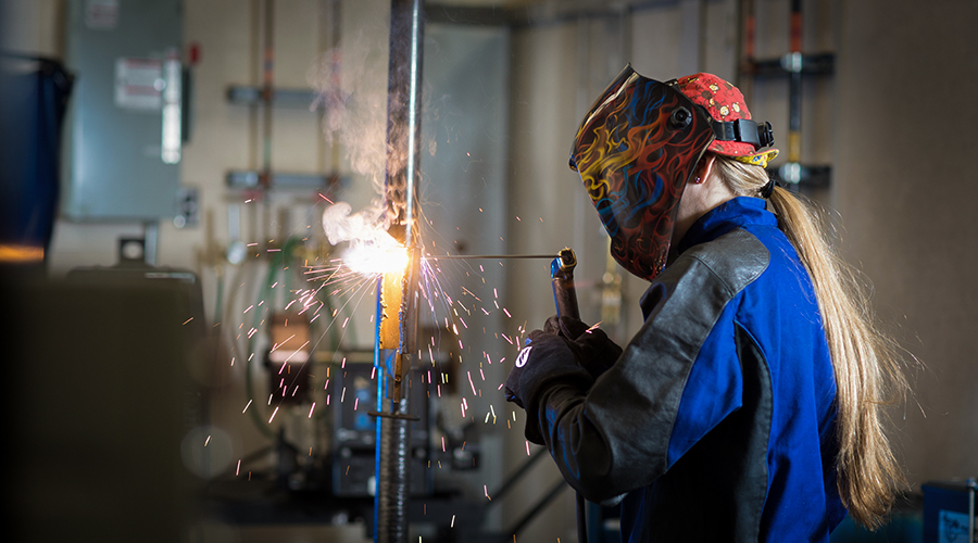 Woman welding at NAIT