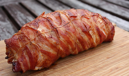 Bacon-wrapped turkey breast stuffed with cranberry and chesnuts