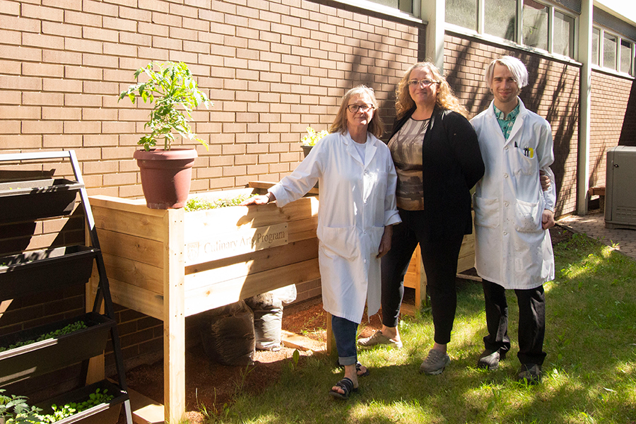 culinary staff at NAIT's on-campus vegetable garden