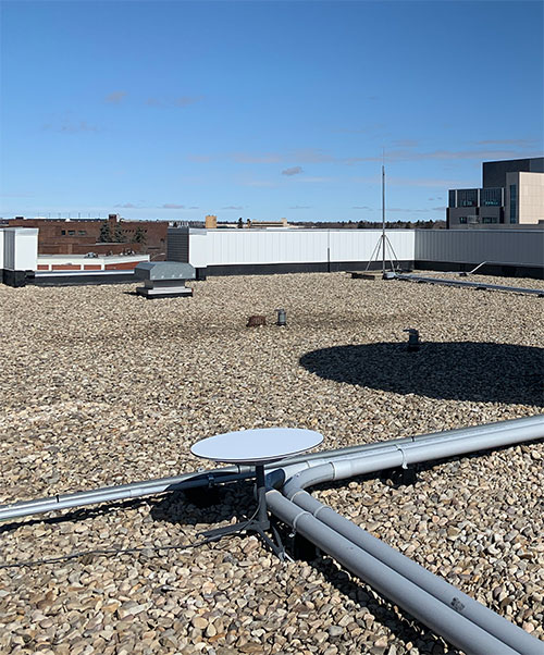 Wireless internet service provider equipment being tested on the rooftop at NAIT main campus